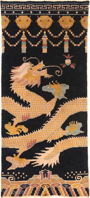 Chinese ‘pillar’ carpet made specifically to go around columns or ‘pillars’ in a Buddhist monastery. Here the golden scaled dragon is depicted chasing the Precious Jewel, with the dragons head and flowing  ...