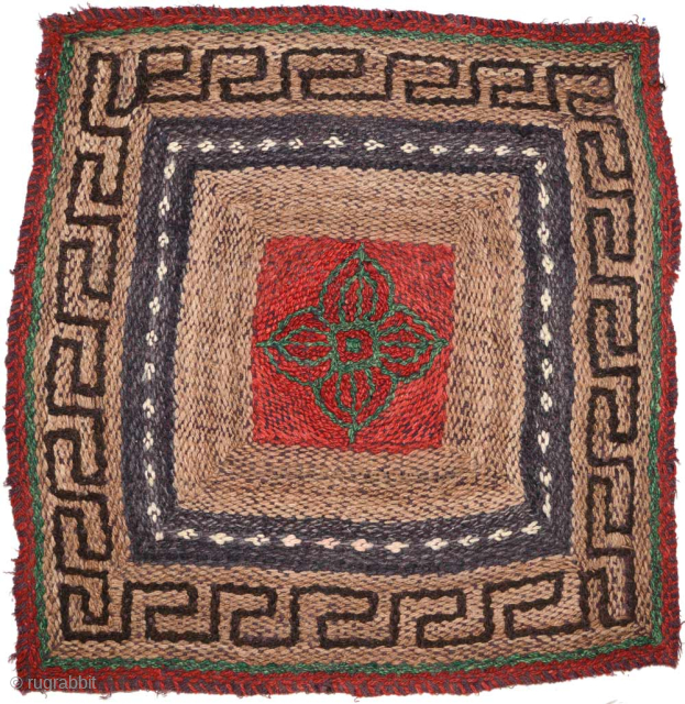 Unique pile-less, flat-woven, Tibetan seating square that is almost certainly nomadic or rural work. It has been constructed using a very interesting and unusual weaving technique (for Tibet) consisting of two ‘layers’;  ...