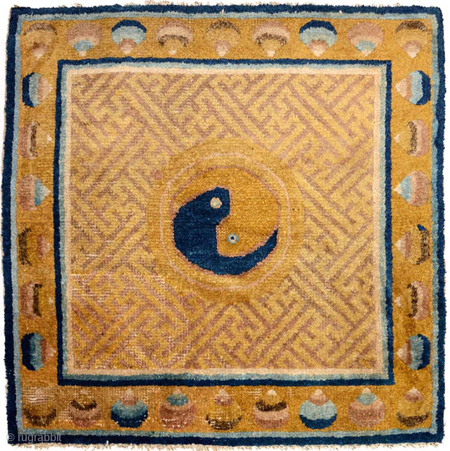 Ningxia seating square featuring the age old Yin and Yang symbol as its central motif set on an interconnected lattice of swastikas with an outer border of precious jewels. Made circa 1800 ...