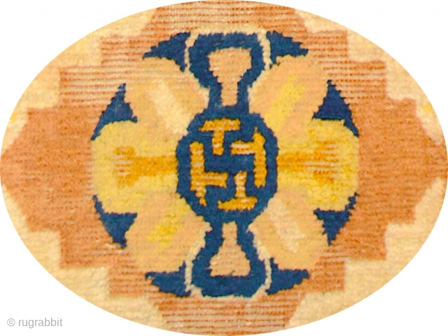 Ningxia mat with an outer main border that uses the 3D ‘T’ design and an inner border of pearls, and a single central swastika inside what may be a stylised 'double dorje'  ...