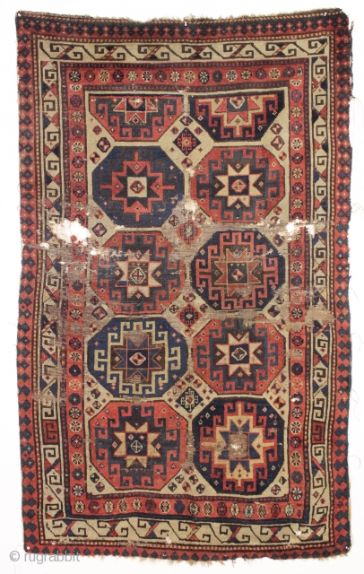 early caucasian rug with archaic drawing. New England find. Moghan? Karrabaugh? Zakatala? "as found", very very dirty with extensive wear and areas of damage as shown. Who knows what it will look  ...