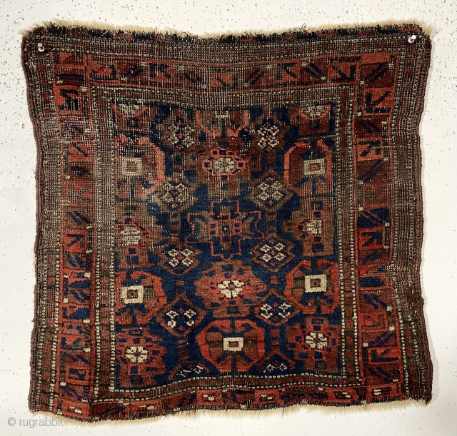 Antique Baluch bagface. Interesting Mina Hani variant. Good natural colors with fine ember reds. Areas of heavy wear as shown. Original selvages. As found, very dirty. 19th c. 24” x 26”  