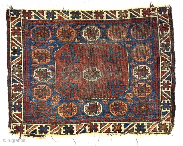 Antique unusually colorful Baluch bagface with an interesting variation of the classic octagon design. Very colorful uncommon border. All natural colors featuring a deep apricot orange and lots of pretty medium blues.  ...