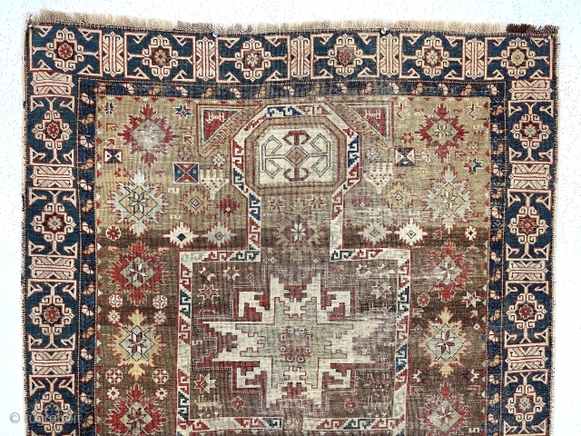 Early Caucasian prayer rug. Kuba?Uncommon design featuring rare combination of lesghi stars, rounded “head” mihrab, large “snowflakes”, hands and nicely drawn “Kufic” border. Complete but overall thin with very low pile and  ...