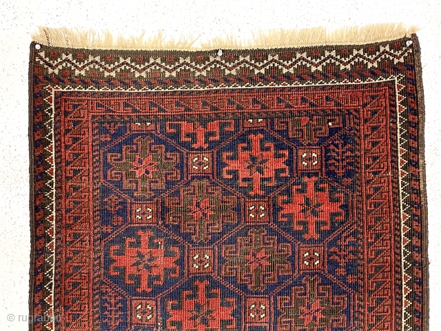 Antique blue ground Baluch rug with an unusual long narrow size, all over tile design and rare piled ends or skirt panels. All natural colors. Overall low pile with considerable oxidized browns.  ...
