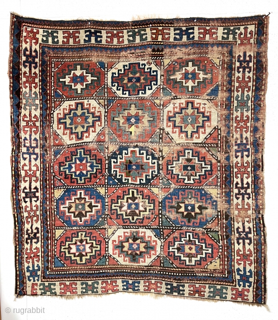 Early colorful moghan Kazak rug with classic memling gul field and nearly square size. Somewhat unusual and spacious ivory border. All good natural colors. As found, scattered areas of wear and a  ...