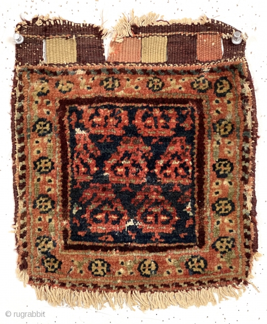 Antique tiny pile bagface, probably northwest Persian, with simple boteh design field and floral meander border. Overall fair pile with a few scattered old small moth nibbles as shown. Original closure tabs.  ...