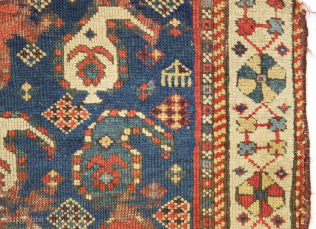 Antique little caucasian rug with an unusual border, unfortunately, ravaged by wolves. Interesting older piece, probably kazak. All natural colors featuring an unusually nice yellow. "as found". 3rd quarter 19th c. 2'8"  ...