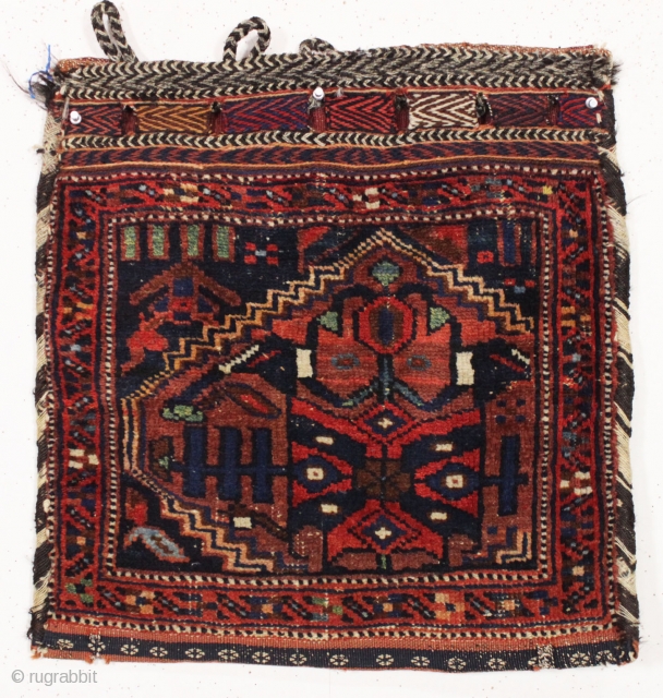 antique northwest persian bag complete with original back. Interesting design using a partial rug medallion. Good pile. All good colors. late 19th c. 20" x 21"       