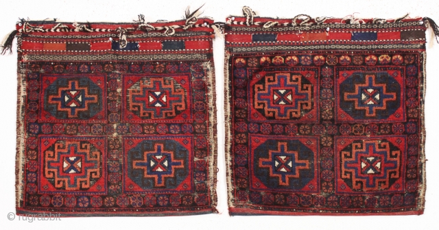 old pair of complete northwest persian or kurdish bags. Interesting design. All good colors. Some wear and heavy brown oxidation. Original backs. late 19th c. each bag app. 25" x 27"   ...