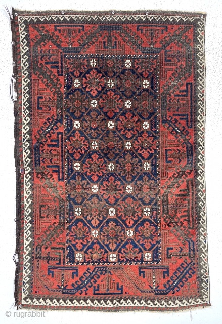 Antique small Baluch rug with a “snowflake” type design and turkman “boat” border. Very good natural color featuring a rich ember red ample white highlights and a deep blue ground. Overall decent  ...