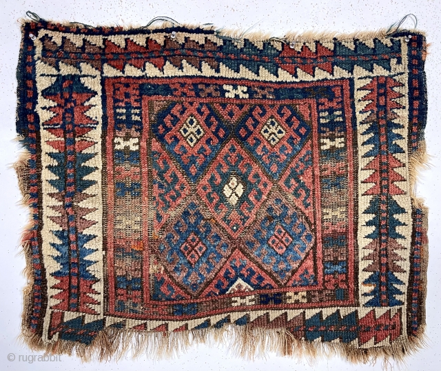 Antique jaf Kurd bagface with some interesting features but in very rough condition. This older example has a somewhat larger scale field and both uncommon main and minor borders. The diamond lattice  ...