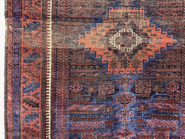 Early blue ground timuri Baluch rug with vivid electric blues. Unusual field design with archaic floral motifs and a beautifully drawn central medallion. All natural colors. Thin and floppy with very fine  ...