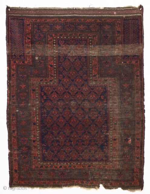 It may look like a black smudge but if you look closely this is an early baluch prayer rug. Blue ground with iconic lattice design and beautiful tree hand panels. All natural  ...