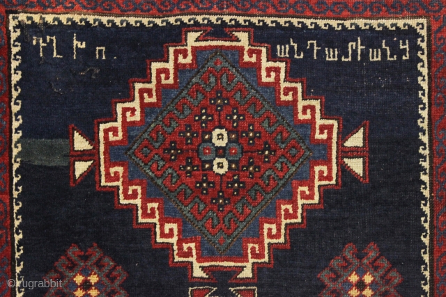 antique kazak or gendge rug with interesting inscriptions. Good thick medium length pile. All natural colors. "As found", very very dirty and with old moth nibbles (dinners) in the deep blue ground.  ...