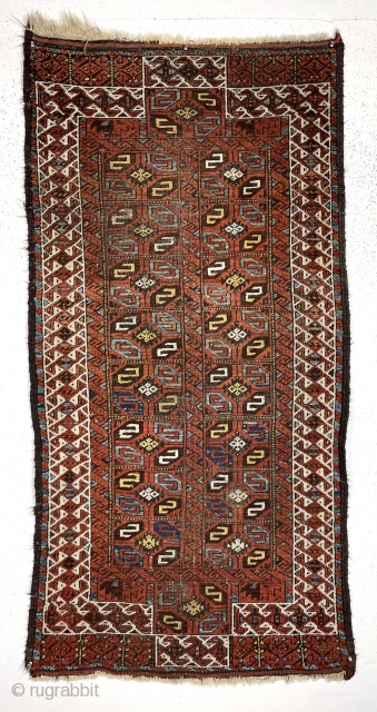 Antique Baluch rug with an unusual version of the double prayer design. Both niches created by offsetting the ivory border rather than the typical continuous design. The “tile” design field is uncommon  ...