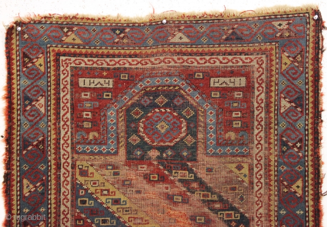 Antique early caucasian prayer rug, dated 1286. Interesting design with an unusual and well drawn border. "As found", very dirty with low pile, some wear and edge roughness as shown. Areas of  ...