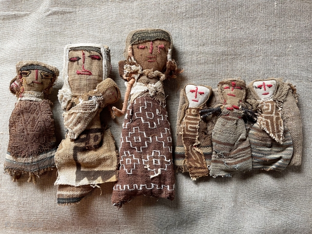 Charming small family of older South American dolls. Constructed using remnant very early fabric. Tallest about 10”.                