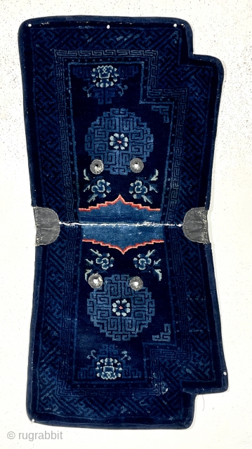 Beautiful antique Chinese saddle rug. Attractive rich indigo blue color and vibrant highlights. Overall mostly good thick lustrous pile. Old cloth backing, probably original. Reasonably clean. Late 19th c.  2’3”x 4’7” 