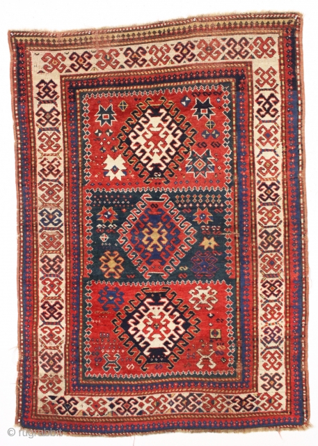 antique kazak rug with an interesting compartment design. All natural colors featuring a good saturated tomato red and nice deep greens. Mostly good pile with some wear and brown oxidation as shown.  ...