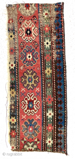 Antique little fragment of an older caucasian rug with beautiful old colors. Delicate drawing and deep brown oxidation. Lovely old purples, greens and yellows. Mid 19th c. 13” x 33”   