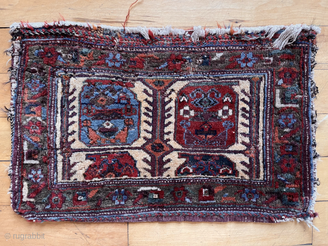 Colorful little antique complete bag, probably Afshar. Decent pile with scattered old moth nibbles. Good wool and saturated natural colors. Original back. Reasonably clean. Cotton warps. Late 19th c. 15” x 22” 