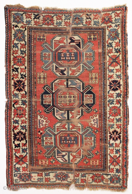 antique kazak rug with a wide "crab" border. All natural colors. As found, very dirty, with wear and some damage as shown but complete with original selvages. In need of at least  ...