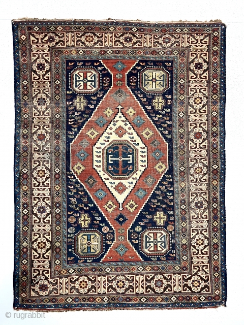 Antique Caucasian shirvan rug with a somewhat uncommon field paired with a nicely drawn Kufic border. Overall even very low pile with scattered wear and oxidation. All natural colors including nice yellow  ...