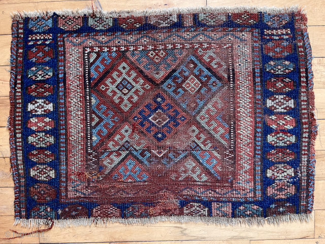 Jaf Kurd Bagface with an uncommon design feature. Notice the field design shift in the bottom third. Older weaving with natural colors and offset knotting as expected. Overall substantial wear and rough  ...