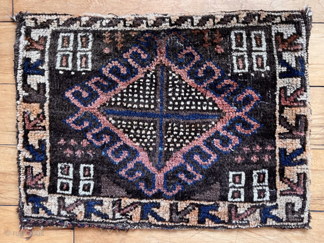 Interesting small complete bag, probably Baluch although an unusual design. Overall good condition with decent even pile. Original back. Side selvages are wrapped internally with typical Baluch goat hair. Good old colors.  ...