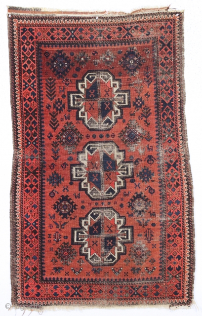 antique little baluch rug. Older example of this interesting type. Thin with wear and heavily oxidized browns as shown. Difficult to photograph but guaranteed all good natural colors. Could use a good  ...