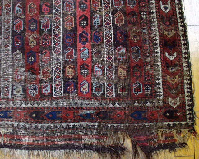 Antique Baluch rug. Interesting design. Rough condition. Unusual range of good natural colors. Has presence. 19th c. rug  4' 4" x 6' 7"         