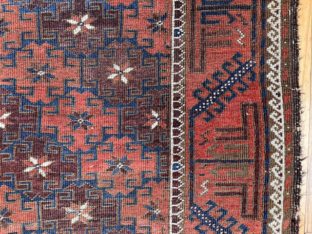 Antique Baluch rug in decent condition for the age. Some low pile and brown oxidation. Uncommon field design of diagonal bands of large latch hooked devises with star centers. Original goat hair  ...