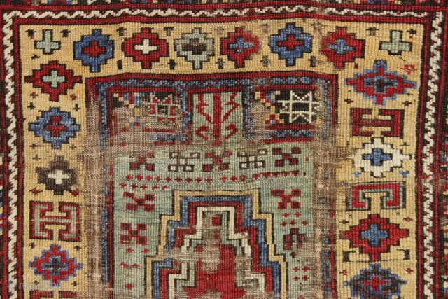 Early Turkish or perhaps Kurdish prayer rug. Interestingand unusual older example in very rough condition. Beautiful natural colors. Fleecy wool. Bits of old crude repair. Could be restored. Good age, ca. 1850.  ...