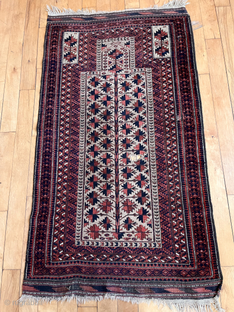 Antique camel ground Baluch prayer rug. Well drawn tree of life design. Good even medium pile with soft lustrous wool. Natural colors. Slight black oxidation. Original goat hair selvages. Several small holes.  ...