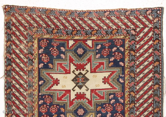 antique caucasian rug, probably shirvan, with bold Lesghi stars and an eye catching border. All natural colors featuring lovely greens and lots of a good old yellow. As found, not restored, with  ...