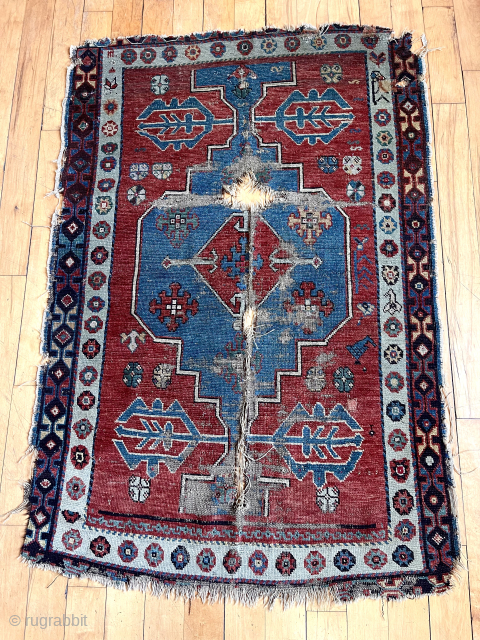 What remains of an early Avar Caucasian rug. Breathtaking bold field and lovely borders. Heavily damaged with tears, edge roughness  and wear. Not for restoration but simply appreciation. Old. 37” x  ...