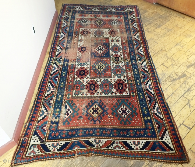 Antique large Kazak rug. Unusual and bold design. As found, in need of restoration. 4'8" x 8'10" 19th c.              