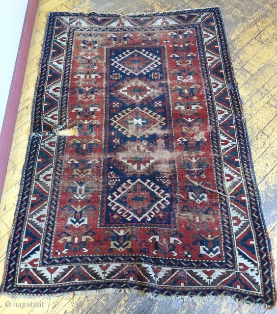Antique little Kazak rug. Nice design and all good colors but with wear and damage as shown. Very dirty. 19th c. 3'9" X 5'9"         