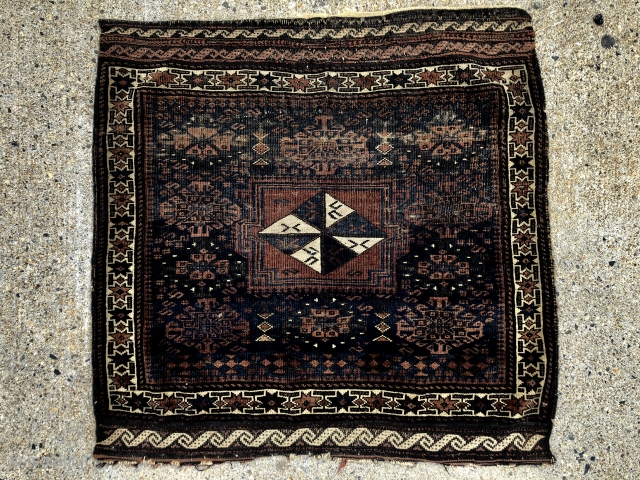 Antique large Baluch bagface with an attractive and rare design. Original selvages and remnant fancy ends. Very low pile with wear as shown. Natural colors. As found, in need of a good  ...