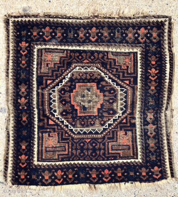 Antique Baluch bagface with interesting turkman influences both in field and border. Fair condition with decent pile and heavy brown oxidation. Remnant selvages. Could use a good wash. Good age. 19th c.  ...