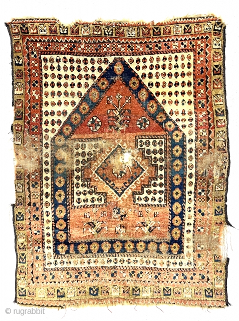 Antique little tribal prayer rug, probably monastir, with eye catching archaic drawing. Rough condition with an assortment of tears, holes, gouges and wear. Some decent pile. Characteristic monastir soft palette. Could use  ...