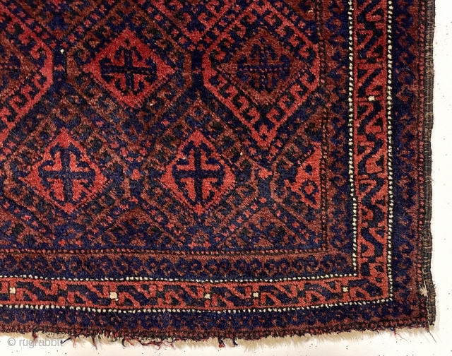 Early large Baluch bagface with rich color and beautiful soft lustrous wool. Complex diamond lattice field with a delicate meander border. Overall good pile. Original selvages. Wonderful cloth like handle. All natural  ...