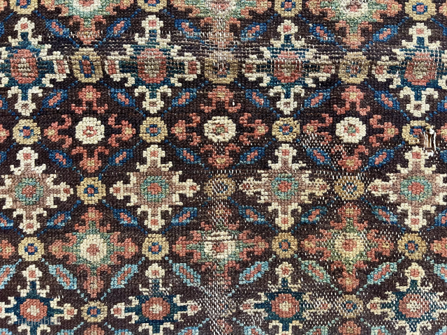 Old fragment of a northwest Persian rug with interesting cloud band motifs. Good old colors. Single wefted. Note the mixed warps with a section in dark brown wool. A fragment I have  ...