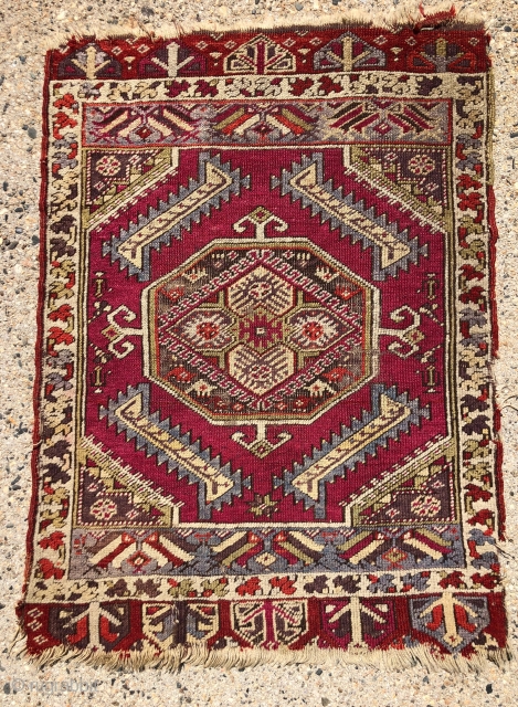 Antique Anatolian yastik. Nicely drawn “saz leaf” design with overall good even low pile. Likely Kersehir. Some heavy brown oxidation. Original selvages, a bit rough. Ends unraveling. Very colorful with no dye  ...