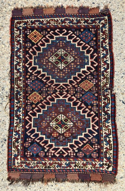 Antique pair of very pretty south Persian bagfaces assembled to make a small mat. Good overall pile with a nice range of natural colors. Ends have original closure tabs. Selvages a bit  ...