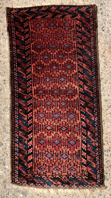 Antique Baluch balisht with full thick pile and good natural colors. Original selvages. Reasonably clean. Nice little weaving. ca. 1900. 17” x 35”.          