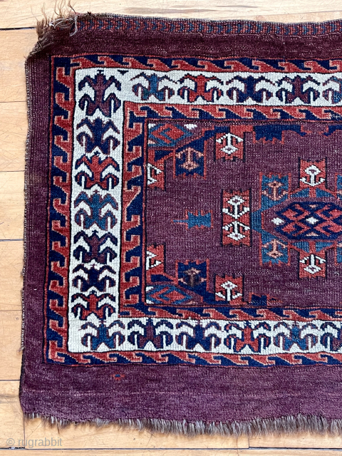 Antique deep purple ground yomud kepse gul torba or kap with fine old colors featuring pretty blue greens. Nice glossy wool. Classic field paired with an attractive uncommon flowering plant border. Reasonably  ...