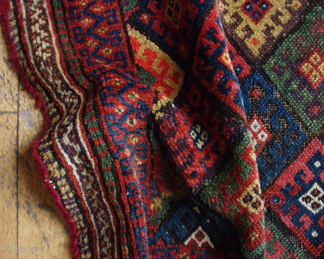 Antique Kurdish bagface. Excellent natural colors including a fine purple and a very good yellow. Rough condition. ca. 1880   2"1" x  3'        