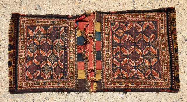 Antique complete original pair of soumak bags. Interesting design including nice pile skirts. Overall very good condition with original goat hair wrapped selvages and colorful closure tabs. Original decorative back with a  ...